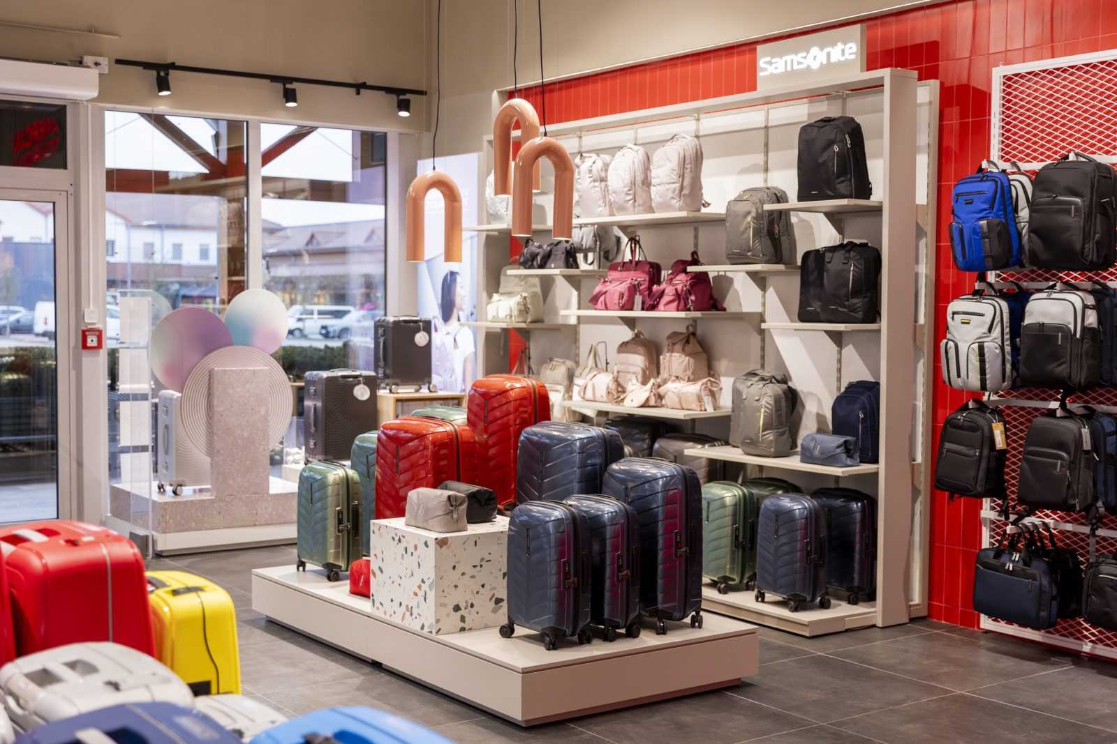 Samsonite luggage and backpacks in a modern retail store.
