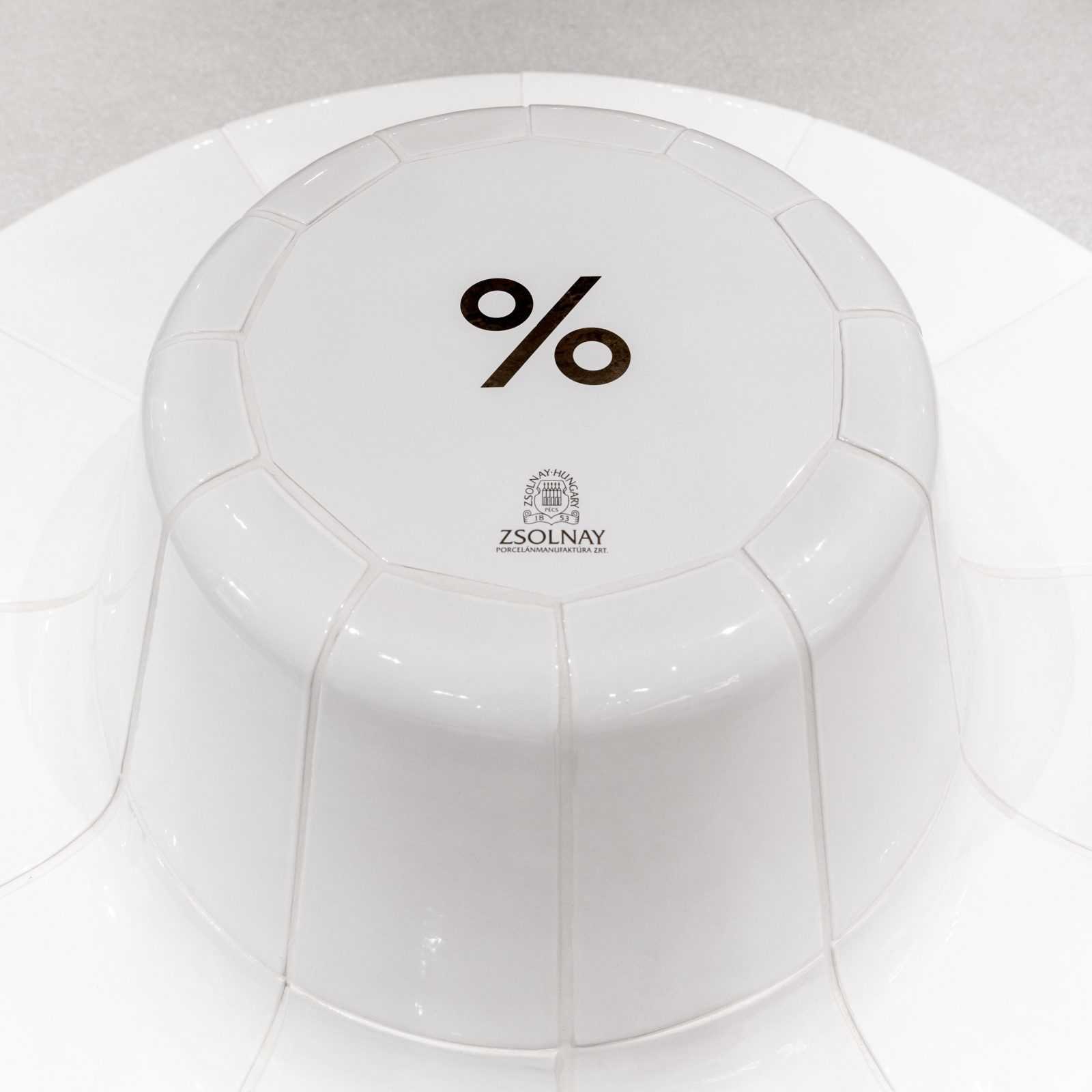 Zsolnay porcelain plate bottom with percentage symbol and brand mark.
