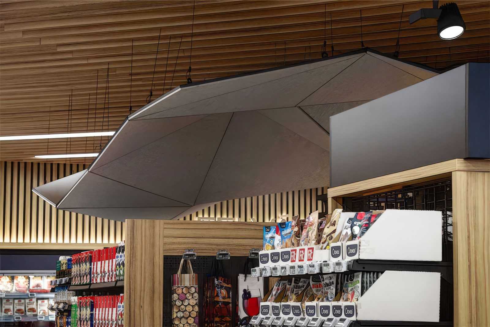 Modern geometric pendant light in wooden ceiling supermarket.