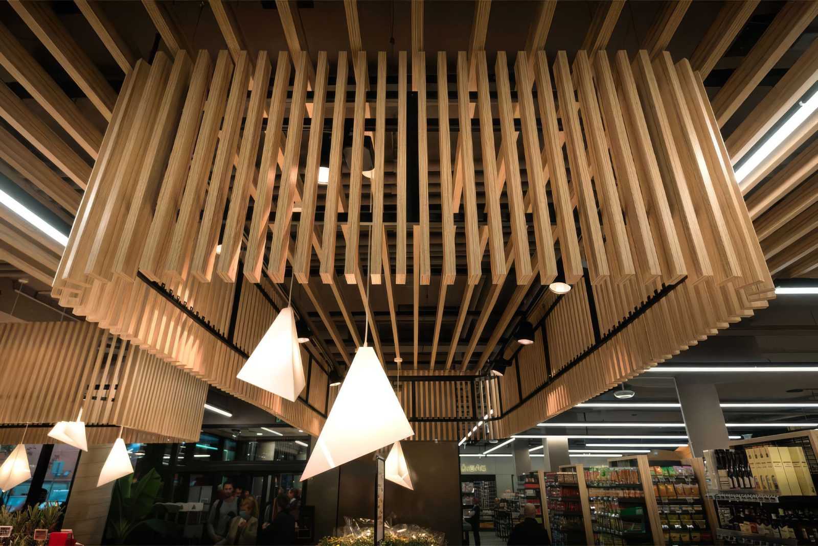 Modern wooden ceiling design in Megaholz store with hanging lights.