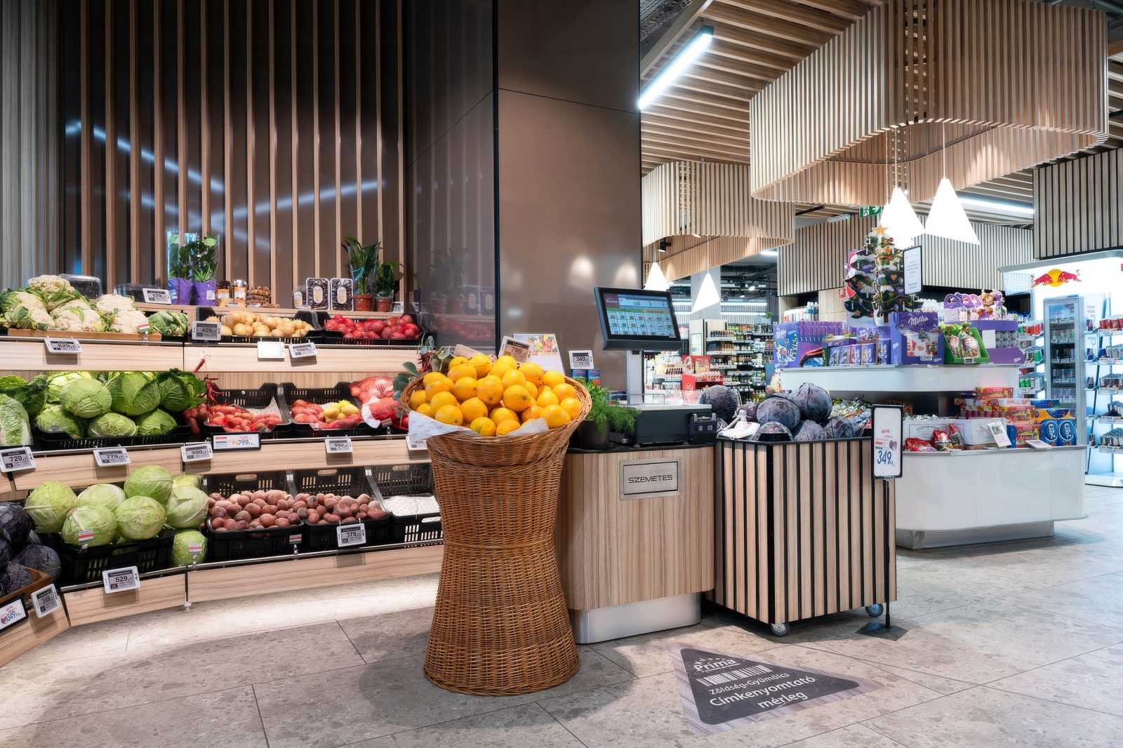 Modern supermarket interior with fresh produce and wooden decor.