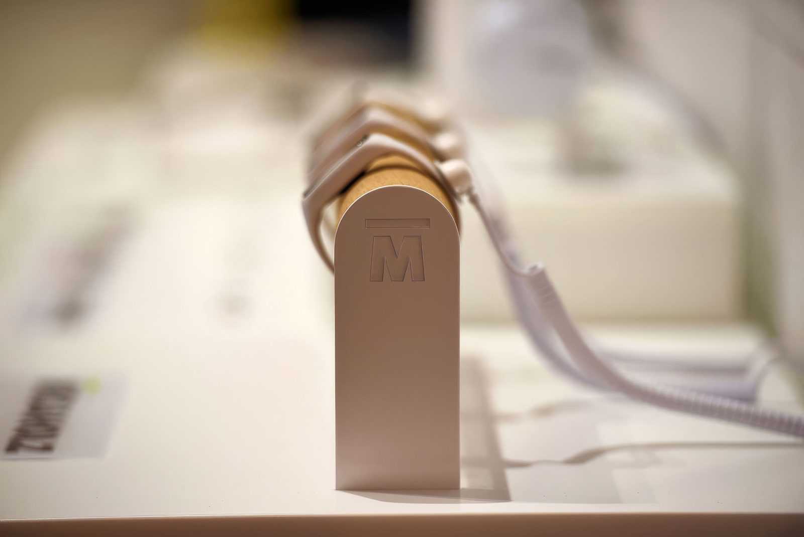 Megaholz logo on wooden display stand.