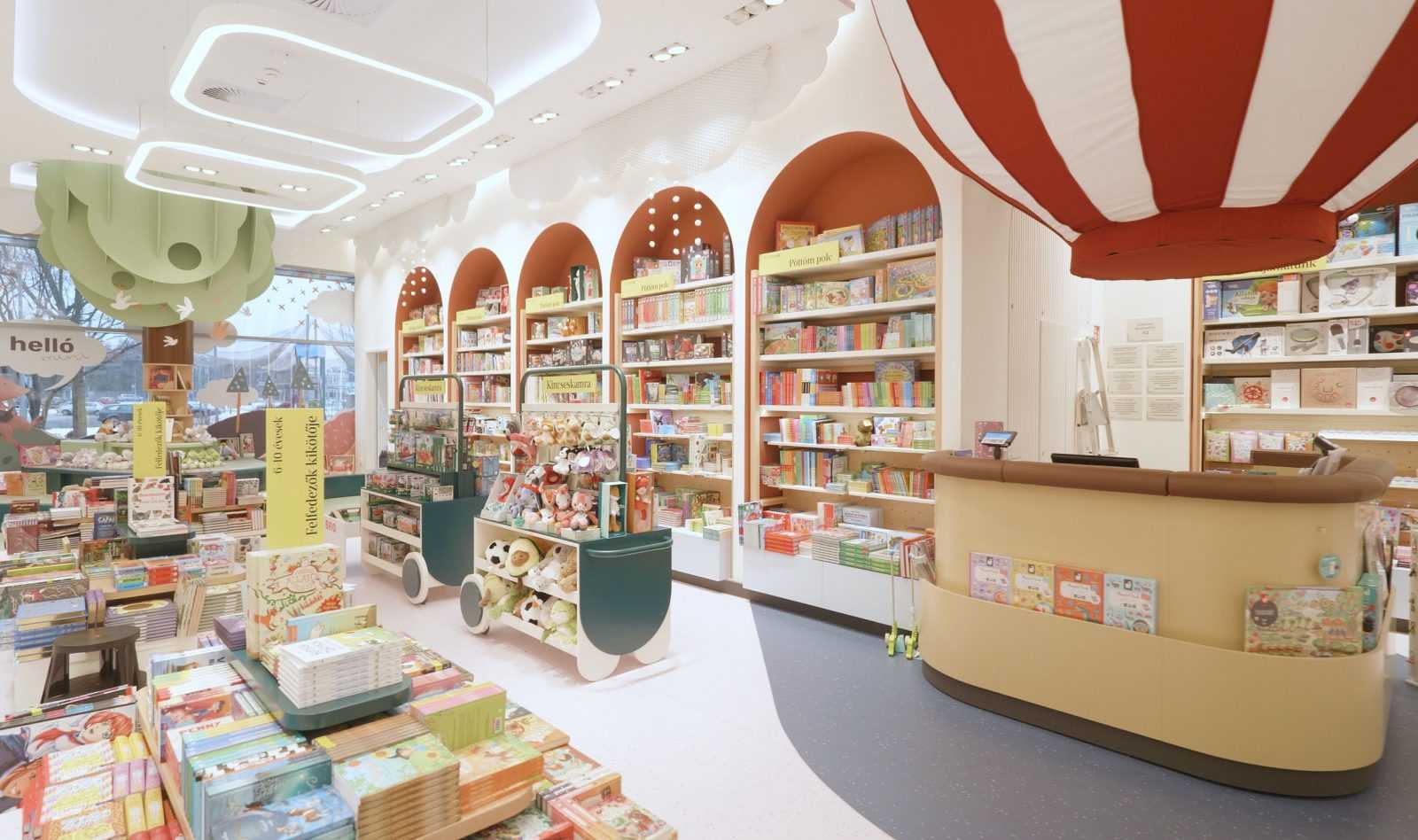 Colorful children's bookstore with bookshelves, toys, and playful decor.