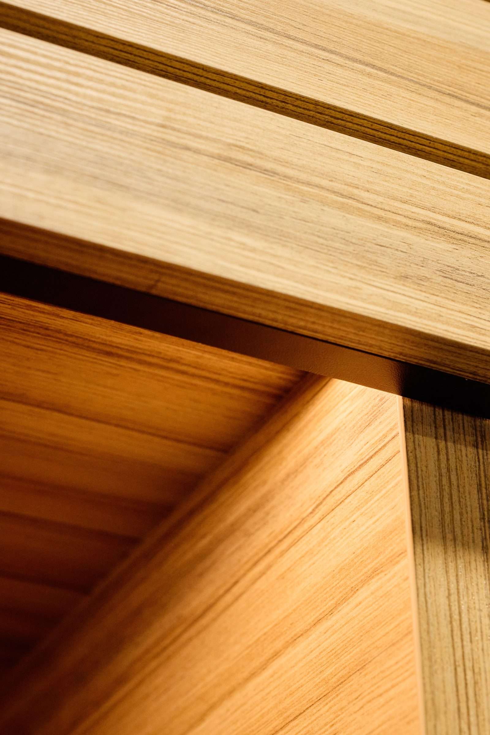 Close-up of natural wood grain texture on modern furniture.