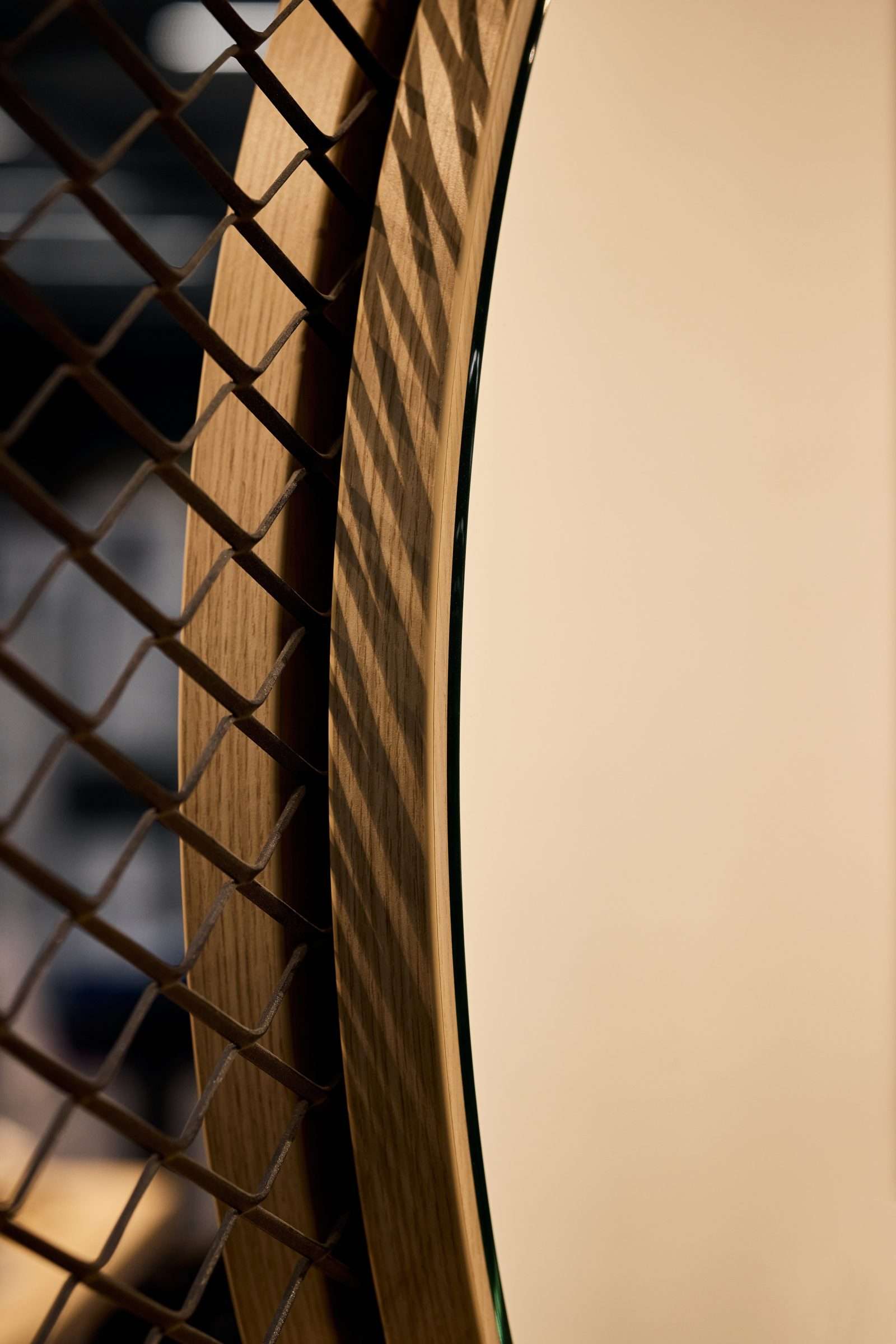 Close-up of wooden frame with chain-link fence shadow.