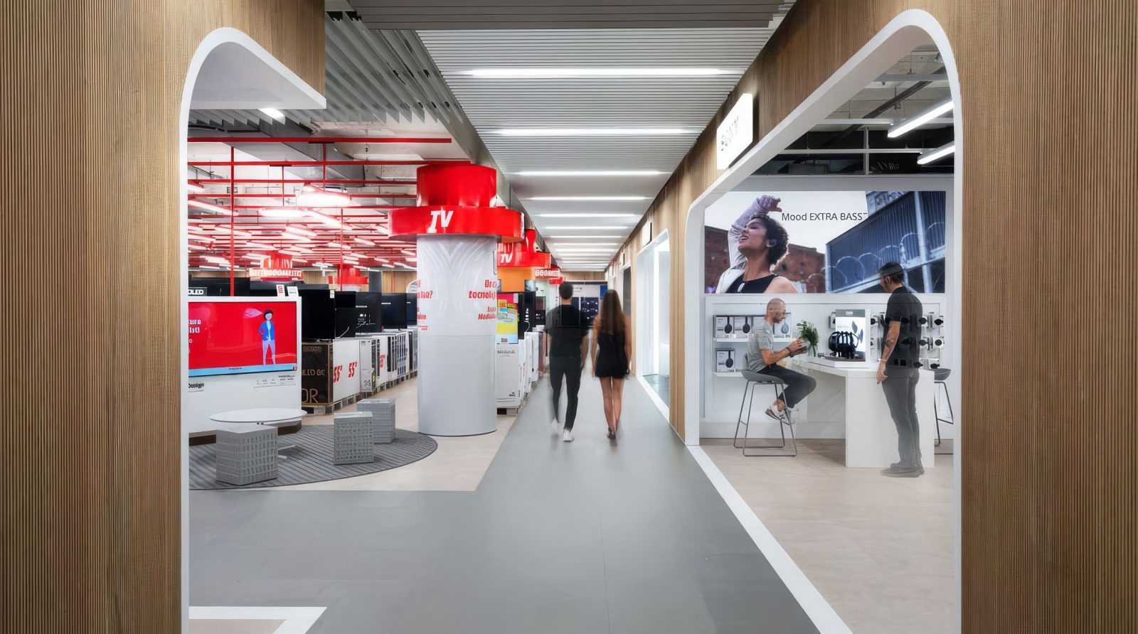 Modern electronics store interior with TV and audio sections.