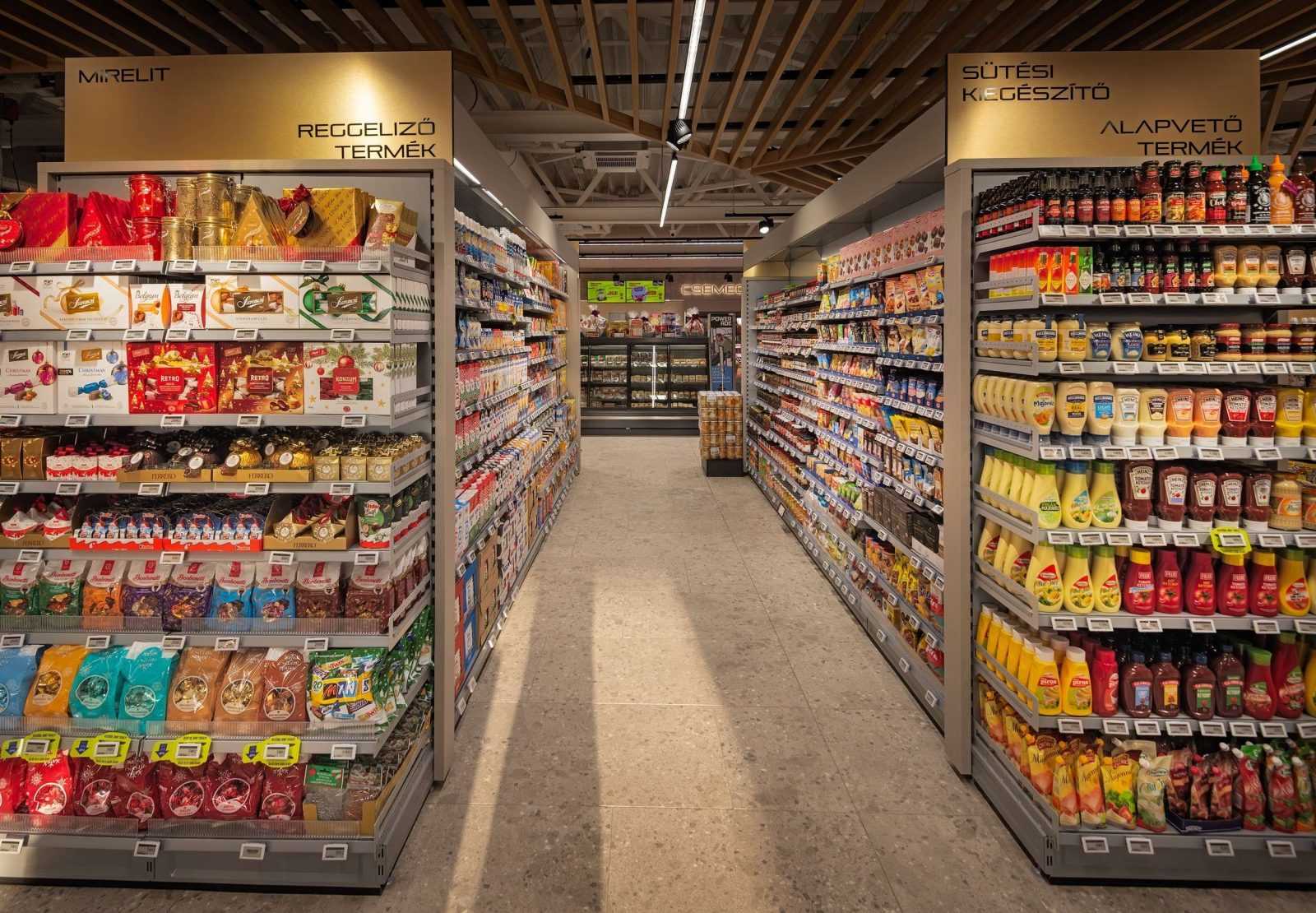 Modern supermarket aisle with breakfast and baking products.