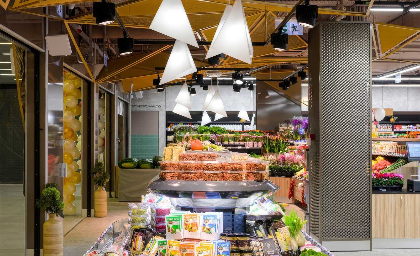 Modern supermarket interior with fresh produce and stylish lighting.