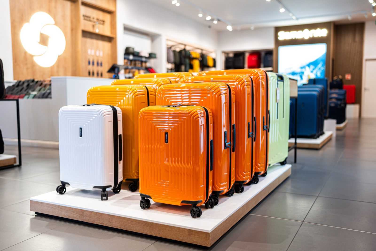 Vibrant Samsonite suitcases on display in modern store.