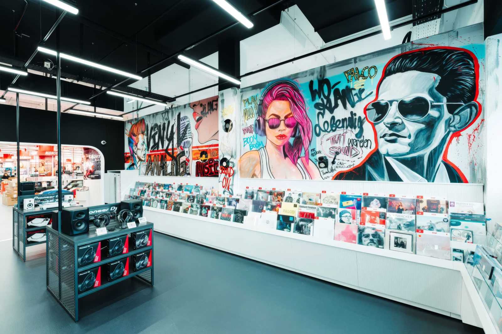 Megaholz store interior with vibrant graffiti murals and vinyl records.