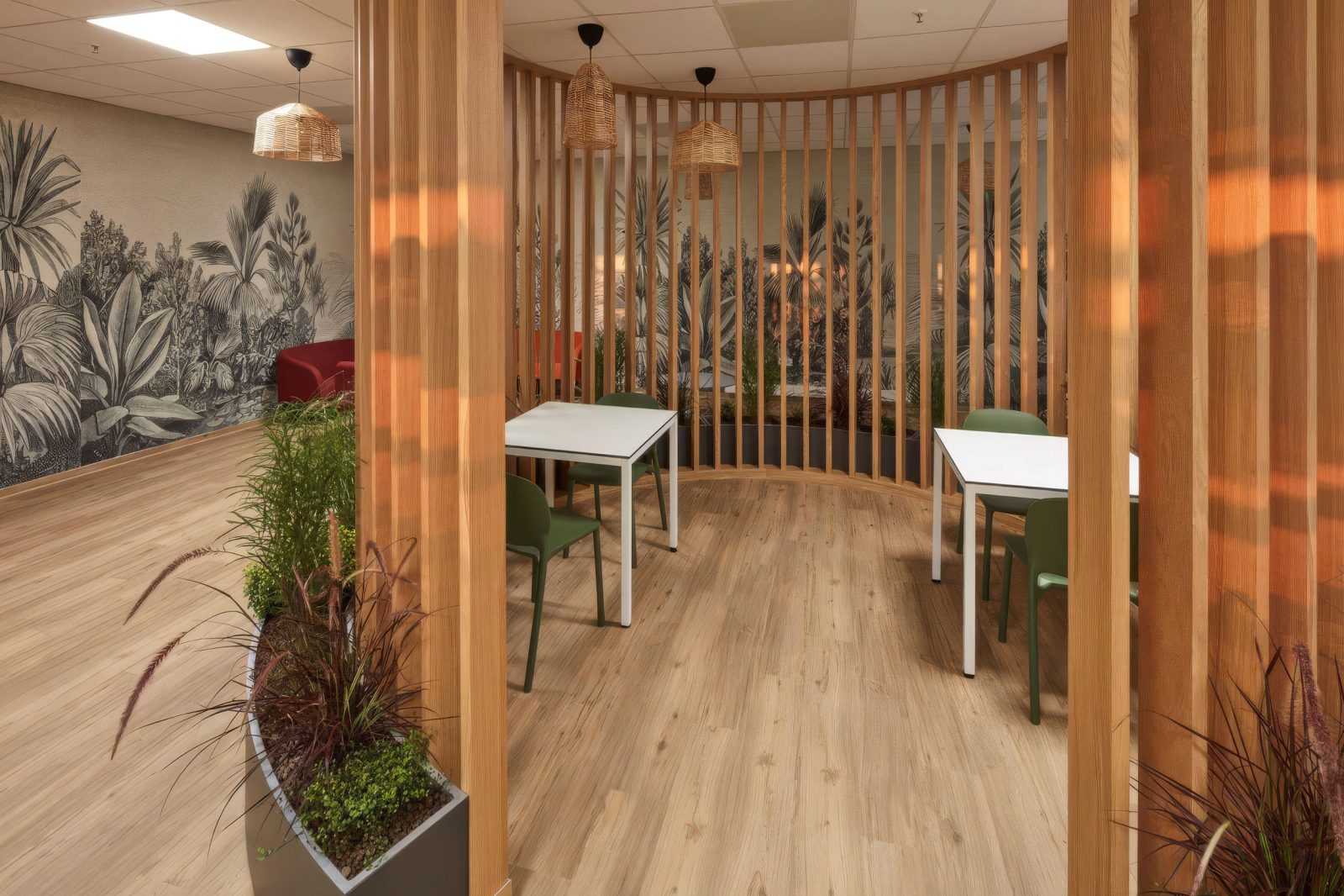 Modern wooden interior with tables chairs and tropical wall mural.